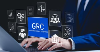 Illustration of governance, risk, and compliance (GRC) dashboard icons over a business professional using a laptop, representing oversight and operational discipline that help organizations avoid Business Central cloud implementation mistakes in Microsoft Dynamics 365 Business Central SaaS environments.