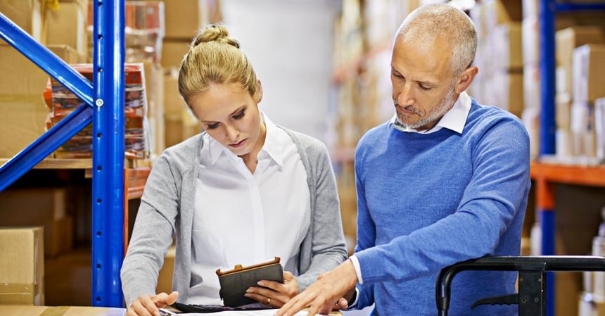 Warehouse managers review inventory and operational processes to improve ERP governance and decision-making.