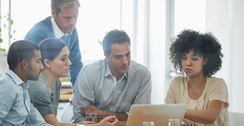 Why ERP implementations fail: project team reviews ERP strategy together during a collaborative office meeting.